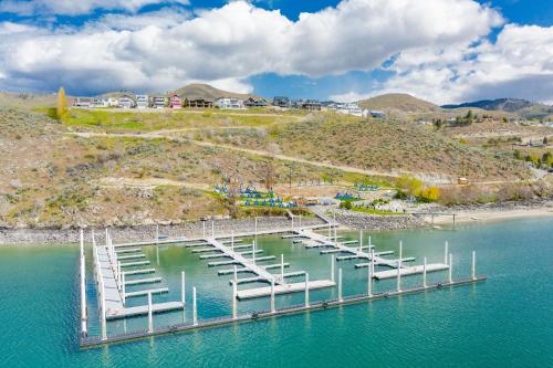 a group of boats parked at a dock in the water at 5 O’Clock Somewhere #113 in Chelan