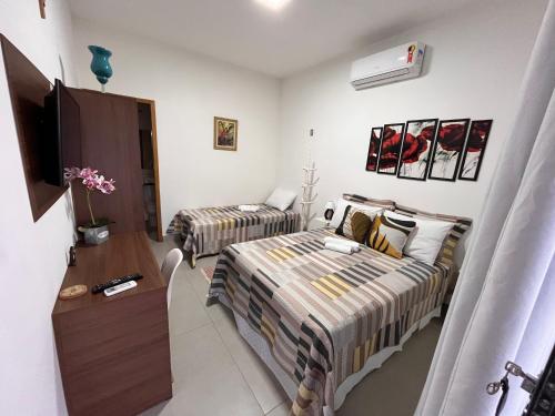 Ein Bett oder Betten in einem Zimmer der Unterkunft Estadia na Canção Nova