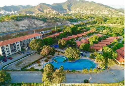 an aerial view of a resort with a swimming pool at VILLAS DEL PALMAR APTO 406 in Santa Marta