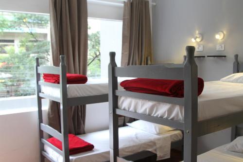 a bedroom with two bunk beds and a window at Soul Hostel Av Paulista Bela Vista 1 in São Paulo