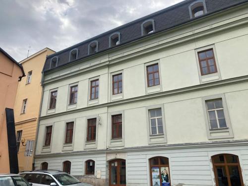 a large white building with a lot of windows at U radnice in Šumperk