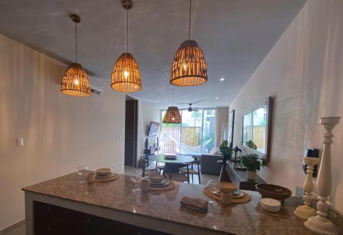 a kitchen with three lights and a counter top at 2 Bed Bath for 5 Casa Azul in Tulum