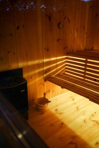 a room with a wooden wall with a bed in it at Le Domaine de Bra in Bra