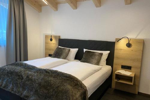 a bedroom with two beds in a room at Haus Pitzi in Sankt Anton am Arlberg