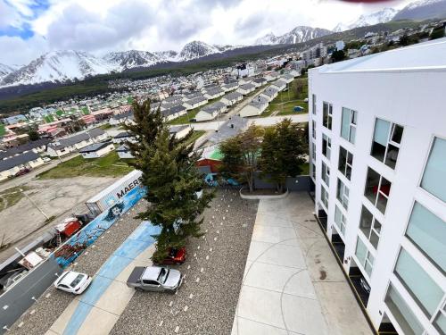 an aerial view of a parking lot in front of a building at Ushuaia Extremo Sur in Ushuaia