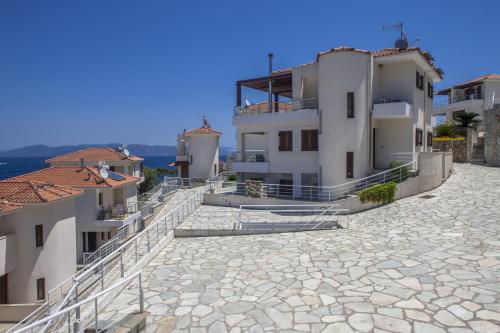 a view of a building from the street at Olivia Sports and Sea in Pteleós