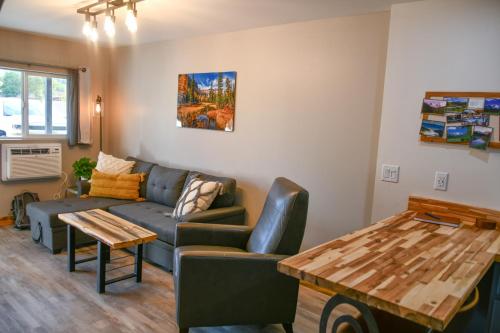a living room with a couch and a table at The Darmont Hotel and Suites in Darby