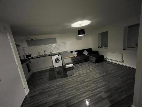 an empty room with a kitchen and a living room at 2 bed hengrove in Brislington