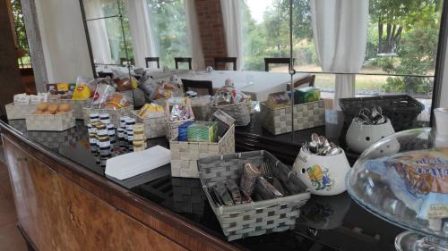 a counter with many baskets of food on it at Casa Tonello Zugliano in Zugliano