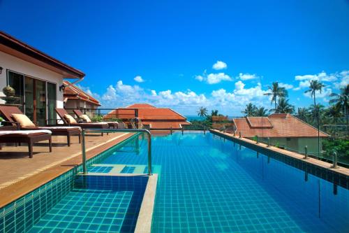 a swimming pool at a villa with a resort at Samui Sunrise Seaview Villa in Chaweng