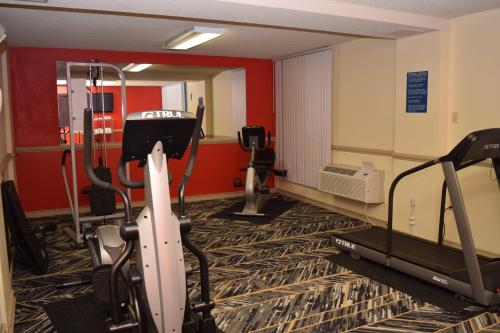 a room with a gym with a treadmill and a mirror at Red Roof Inn Batavia in Batavia