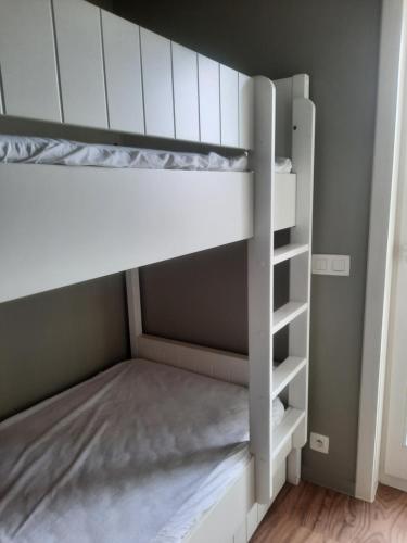 a white bunk bed in a room at Penthouse VI in Koksijde