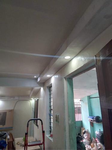 a room with a ceiling and a room with a mirror at Balili Property at Metro Manila Hills Subd Rodriguez Rizal in Manila
