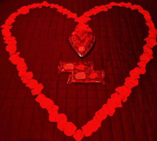 a heart made of red hearts on a red dress at B&B The View all'Acquedotto in Rome