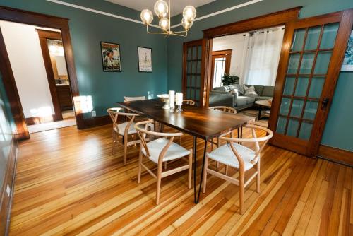 a dining room with a table and chairs at Gulf Coast Craftsman - Cozy, Charming & Central! in Gulfport