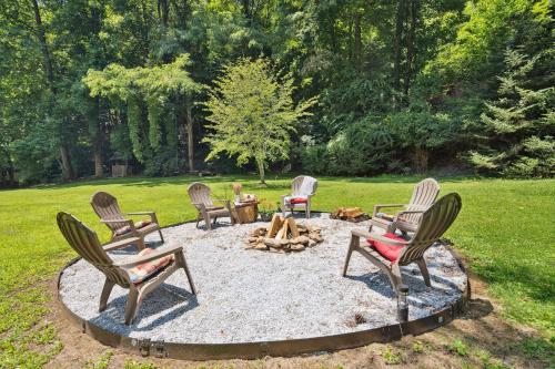 a group of chairs around a fire pit in a yard at Twin Ponds Retreats retreat in Whittier