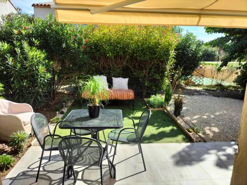 Taman di luar Maison dans une résidence de vacances