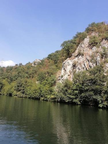 a large body of water next to a mountain at Ovcar banja in Čačak