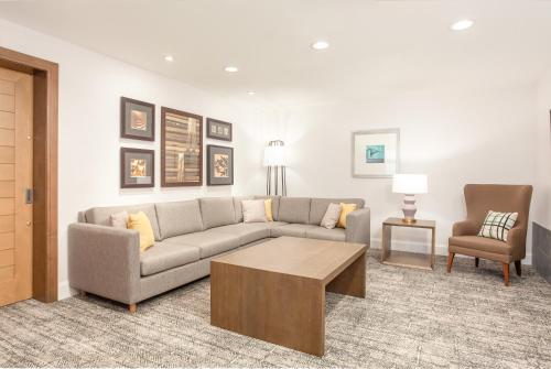 a living room with a couch and a coffee table at Staybridge Suites - San Bernardino - Loma Linda in San Bernardino