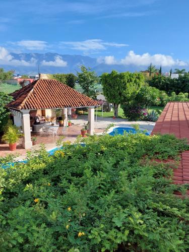 a view of a house with a swimming pool at Casa Quinta Mar, Casa de campo en el Tule, Oaxaca. in Santa María del Tule