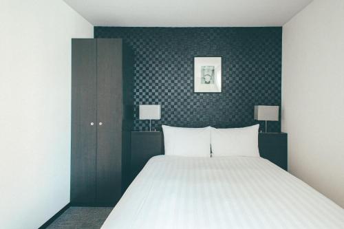 Ліжко або ліжка в номері Hamilton Hotel Black