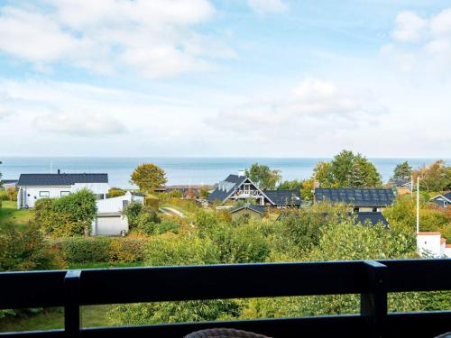 a view of the ocean from the balcony of a house at 10 person holiday home in Alling bro in Nørager