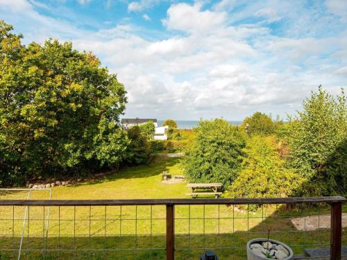 a view from a balcony of a park with a picnic table at 10 person holiday home in Alling bro in Nørager