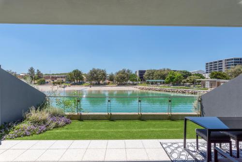 a view of a body of water from a balcony at Maraboo Island Beachfront Villa in Fremantle