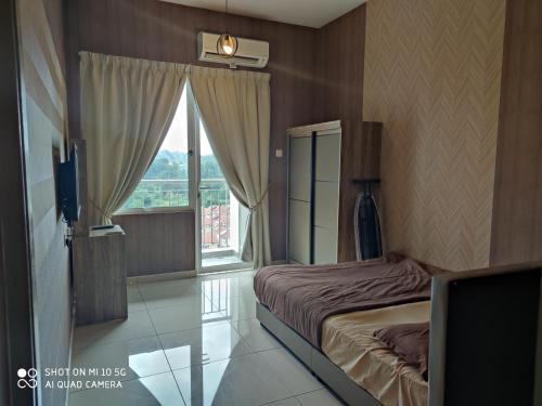 Krevet ili kreveti u jedinici u okviru objekta Bangi Gateway Service Apartment