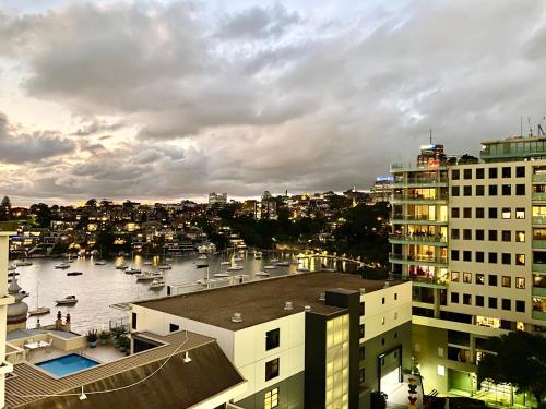 a view of a city with boats in the water at Milson Serviced Apartments in Sydney