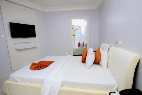 Postel nebo postele na pokoji v ubytování Hotel Galilée