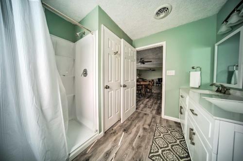 a bathroom with a shower and a sink and a toilet at Spacious Geneva House Less Than 5 Mi to The Strip! in Geneva