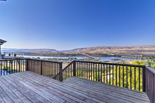 a wooden deck with a view of the water at Incredible Oregon Retreat with Private Hot Tub! in The Dalles