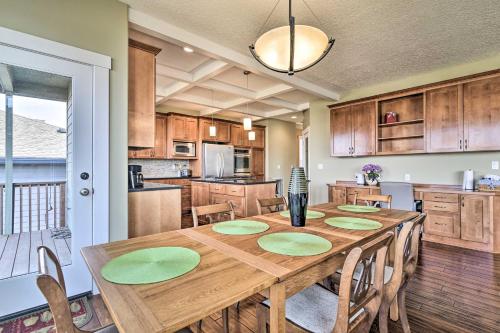 a kitchen and dining room with a wooden table and chairs at Incredible Oregon Retreat with Private Hot Tub! in The Dalles