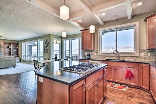 a kitchen with a stove top oven in a room at Incredible Oregon Retreat with Private Hot Tub! in The Dalles