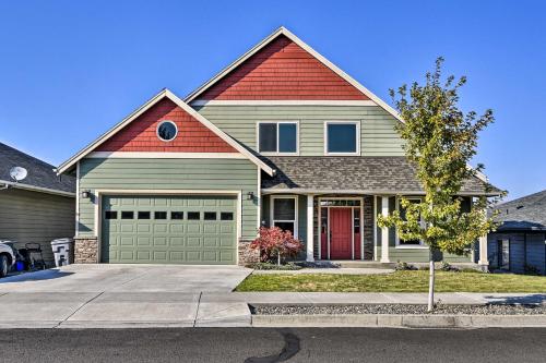 a house with a red roof and a garage at Incredible Oregon Retreat with Private Hot Tub! in The Dalles