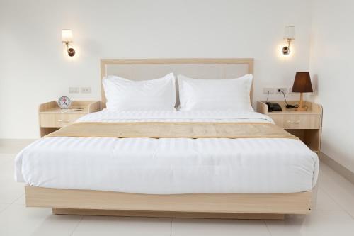 Ein Bett oder Betten in einem Zimmer der Unterkunft One El Nido Suite