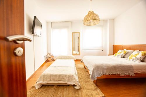 Ένα ή περισσότερα κρεβάτια σε δωμάτιο στο Solpor Marín