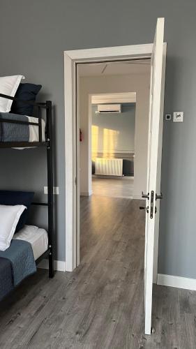 a room with two bunk beds and a hallway at Express Inn in Poti