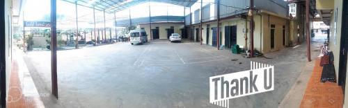 an empty parking lot in a building with a bus at Hong Minh Guesthouse in Mù Cang Chải