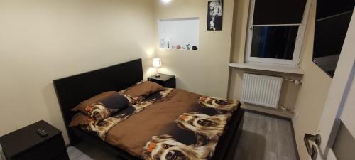 Ένα ή περισσότερα κρεβάτια σε δωμάτιο στο Apartament CENTRUM