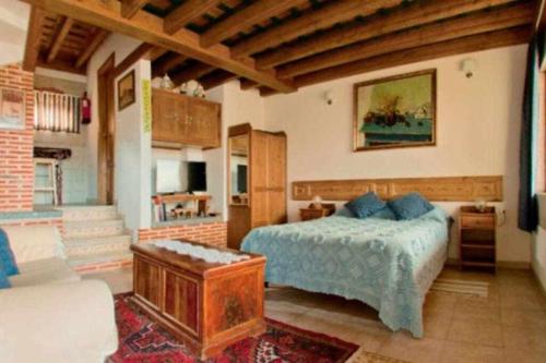 Postel nebo postele na pokoji v ubytování Apartamento rural El Pastor es un estudio con gran