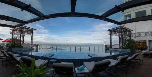 a large swimming pool on the roof of a building at Admiral Hotel Manila - MGallery Collection in Manila