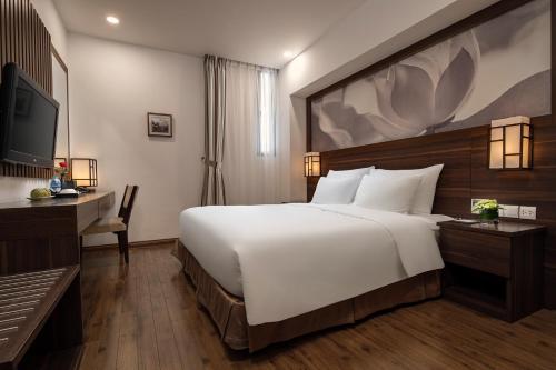 Authentic Hanoi Boutique Hotelにあるベッド