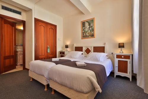 Postel nebo postele na pokoji v ubytování Hôtel Playa
