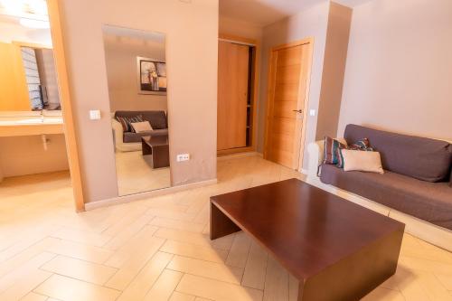 a living room with a couch and a coffee table at Hotel Kika in Santa Marta