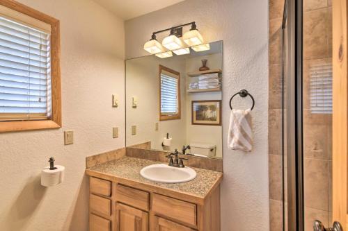 a bathroom with a sink and a mirror at Cozy Cabin with Mountain Views about 4 Mi to Grand Lake! in Grand Lake