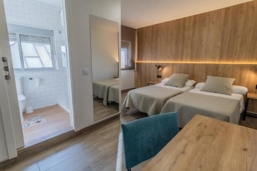 Posteľ alebo postele v izbe v ubytovaní Hotel Kika