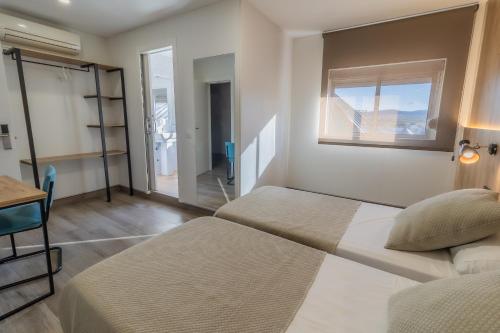 Ένα ή περισσότερα κρεβάτια σε δωμάτιο στο Hotel Kika