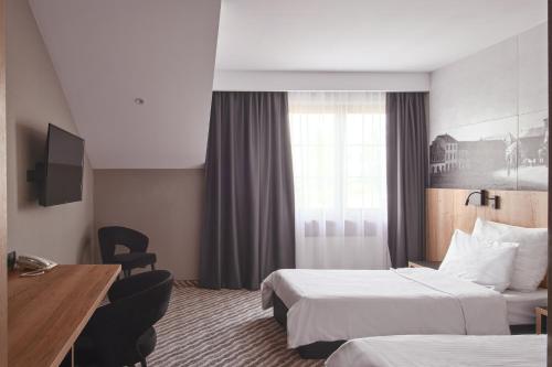Artis Hotel & Spaにあるベッド